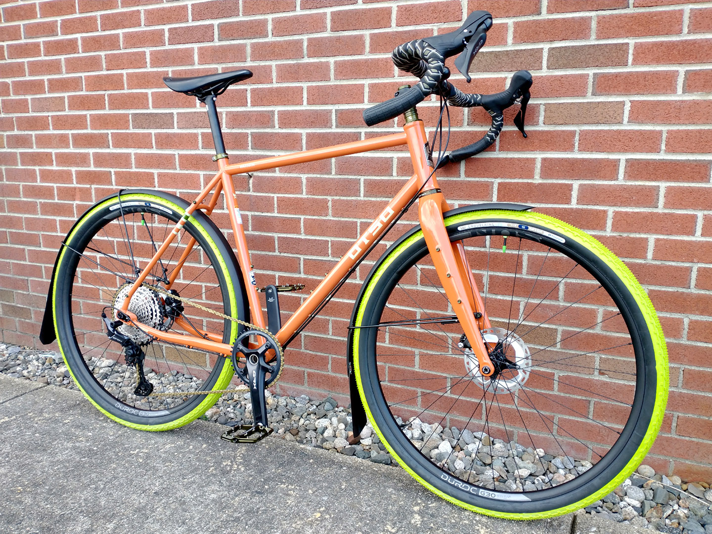 Otos Warakin 4130 Chromoly Steel in Tangerine with Match Green Panaracer Gravel King Tires